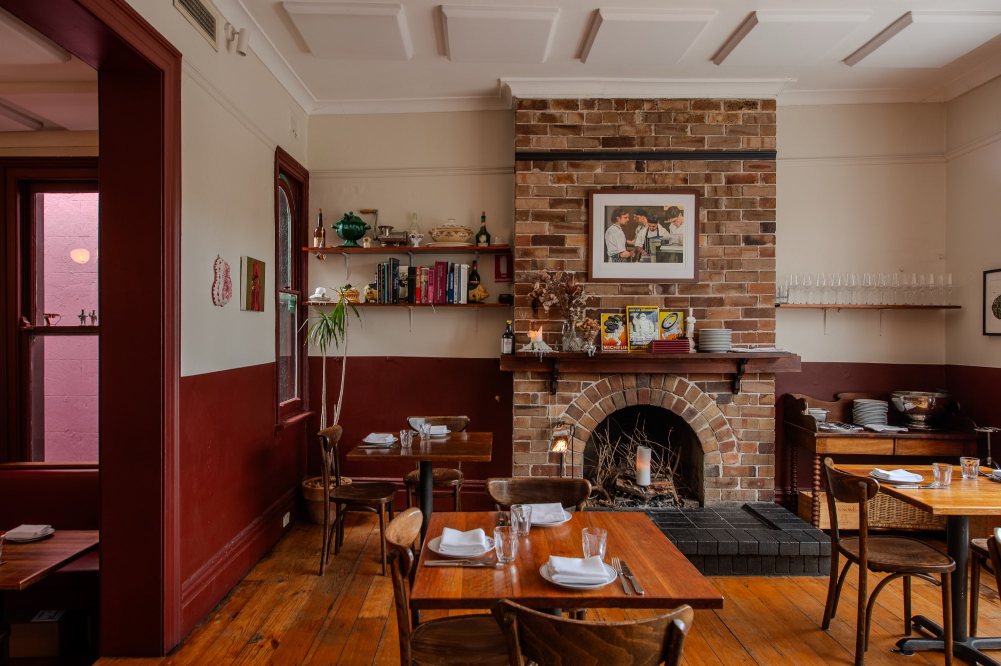The heritage dining room at Porcine, Sydney, with its fireplace