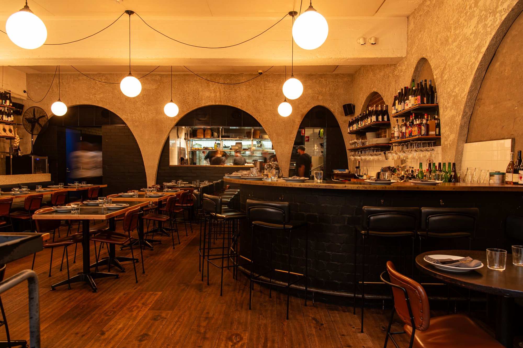 The arched dining room and wine wall at Ester, Sydney